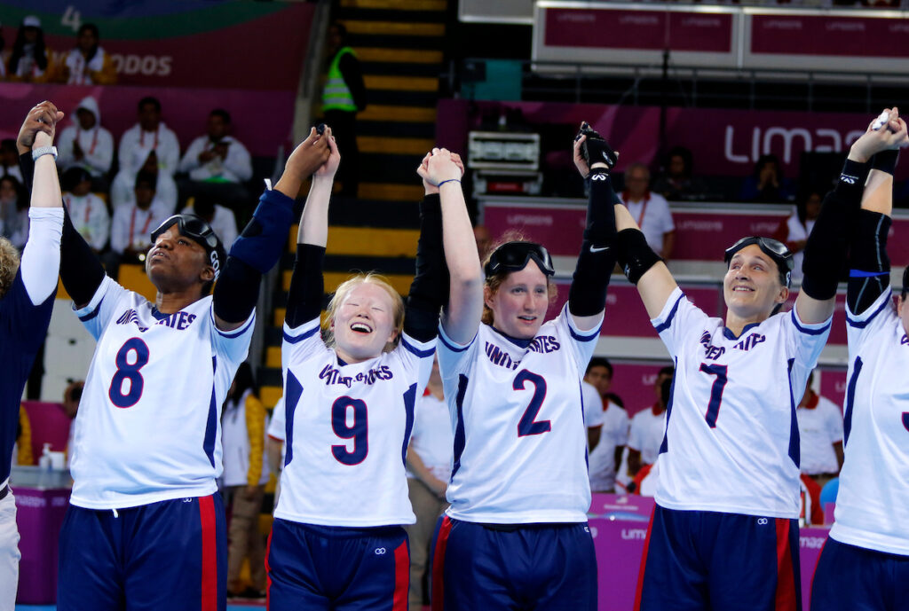 Marybai Huking, the number 9, holds her hands aloft with her teammates at the Lima 2019 Parapan American Games