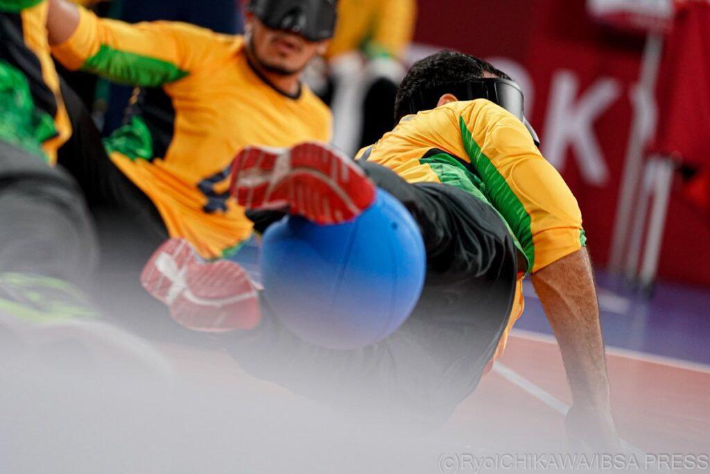 A goalball is pictured being saved by the legs of a Brazilian goalball player at the Tokyo 2020 Paralympics