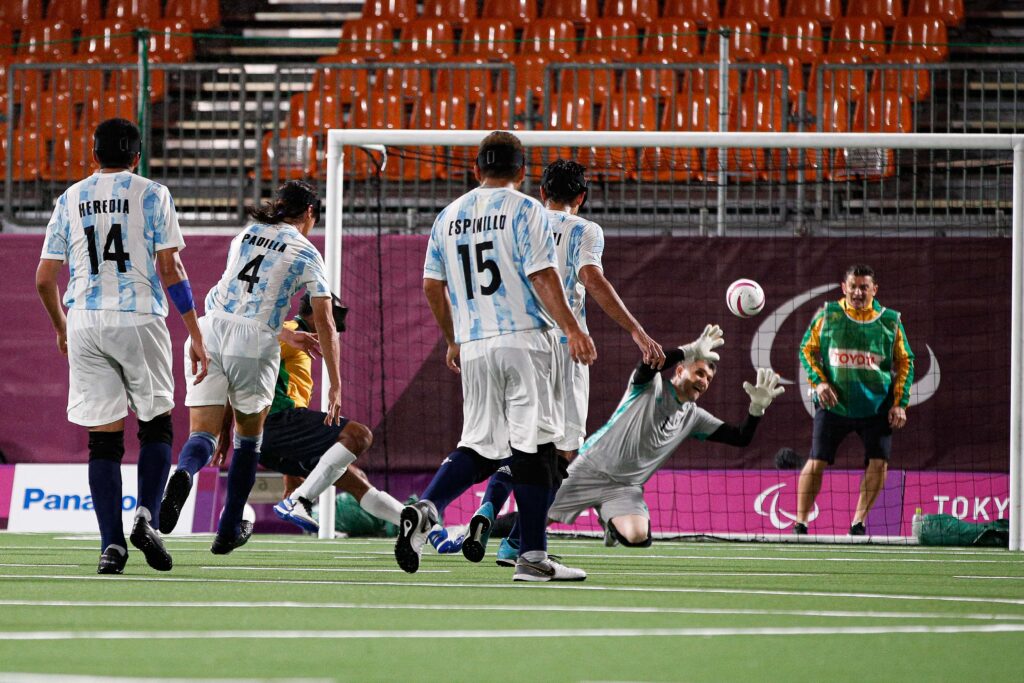 Argentinian players pause as a ball flies into their goal