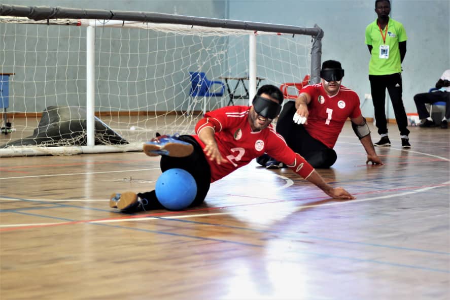 A male player from Algeria makes a save with his legs