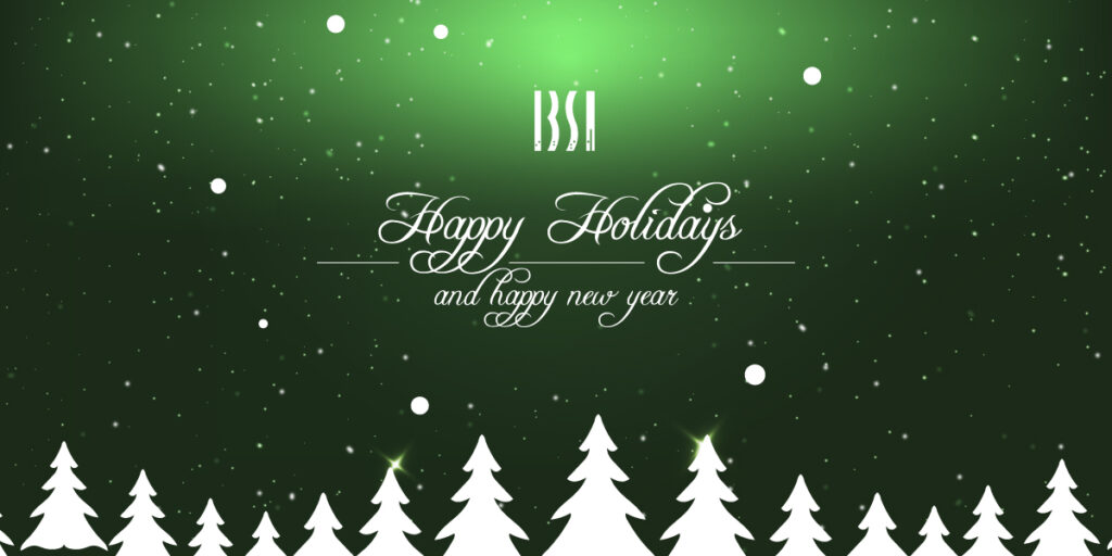 A line of Christmas trees sits below the worlds Happy holidays and a happy new year 2022 with the IBSA logo