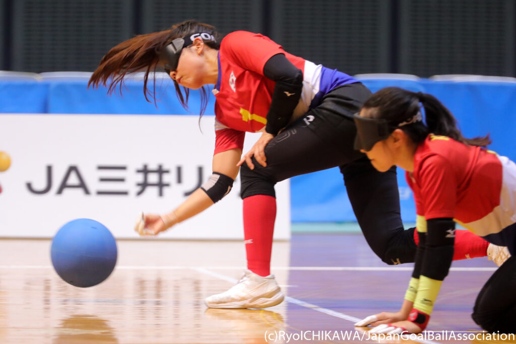 The ball is just leaving the hand of a female player from South Korea