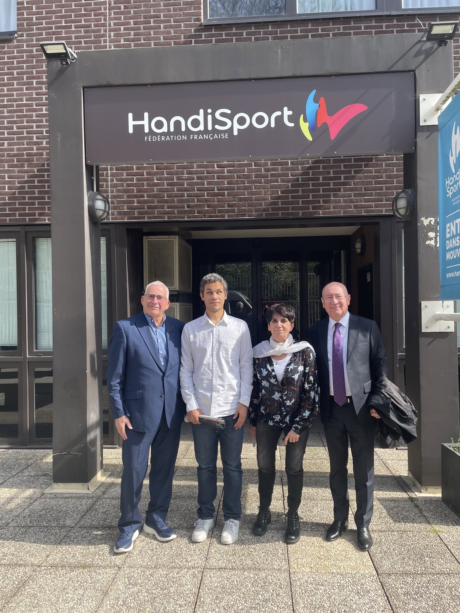 IBSA President Ilgar Rahimov and Executive Director Tony Sainsbury meet with Ghislaine Westlnyck and Gael Riviere outside the headquarters of Handisport